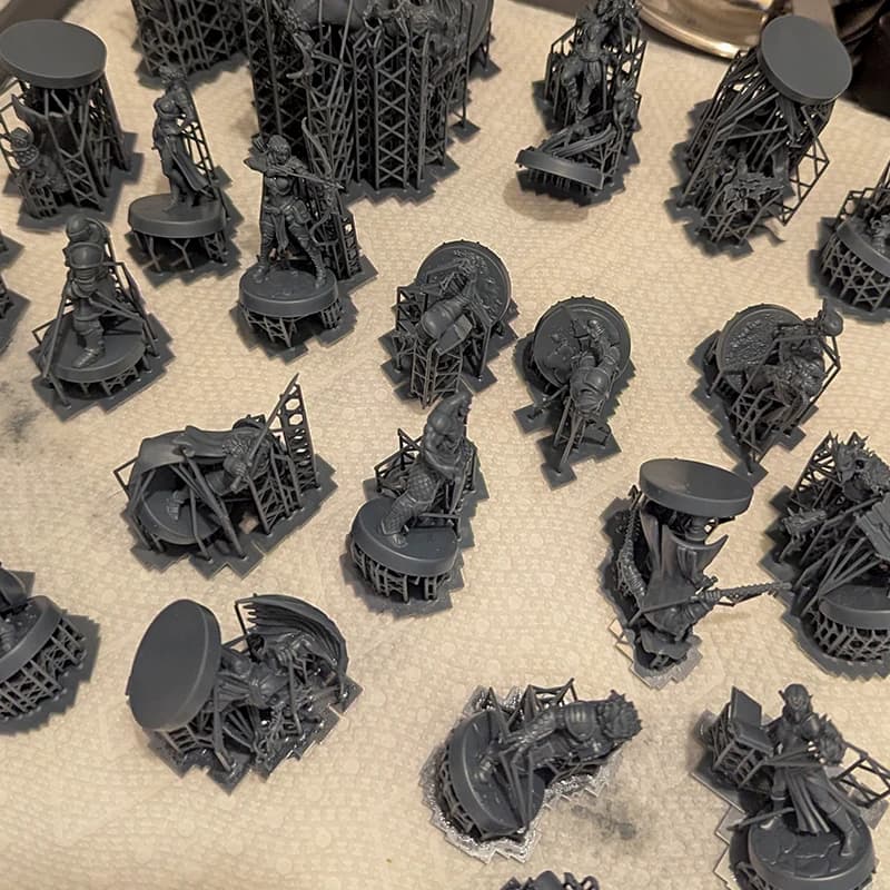 Freshly printed resin miniatures with their supports still attached